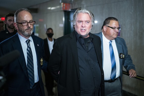 Former White House strategist Steve Bannon is escorted to the courtroom of the Manhattan district attorney&#039;s office after surrendering to New York authorities, Thursday, Sept. 8, 2022, in New Yor ...