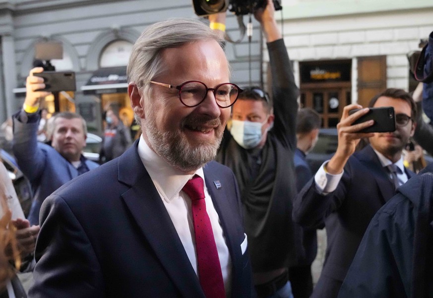 Leader of center-right Spolu (Together) coalition Petr Fiala smiles at election staff in Prague, Czech Republic, Saturday, Oct. 9, 2021. The center-right Together coalition was capturing 23.9% of the  ...