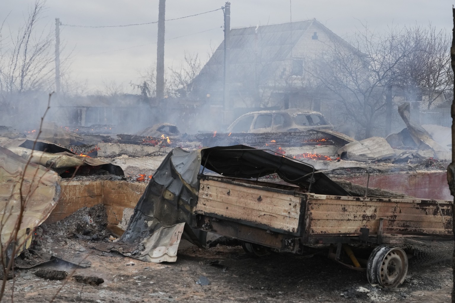 The debris of a privet house in the aftermath of Russian shelling outside Kyiv, Ukraine, Thursday, Feb. 24, 2022. Russia on Thursday unleashed a barrage of air and missile strikes on Ukrainian facilit ...