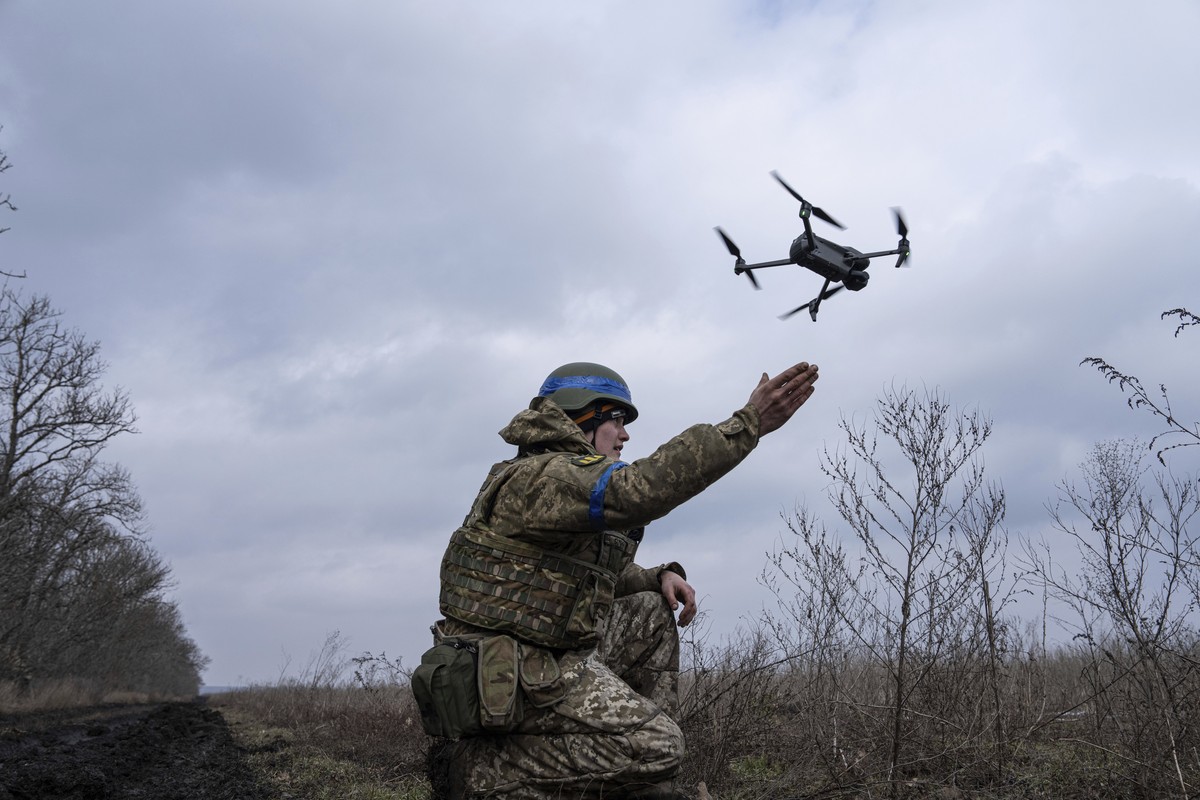 A Ukrainian serviceman of the 68 Oleksa Dovbush hunting brigade, launches a drone at the frontline near Vuhledar, Ukraine, Wednesday, Feb. 22, 2023. (AP Photo/Evgeniy Maloletka)