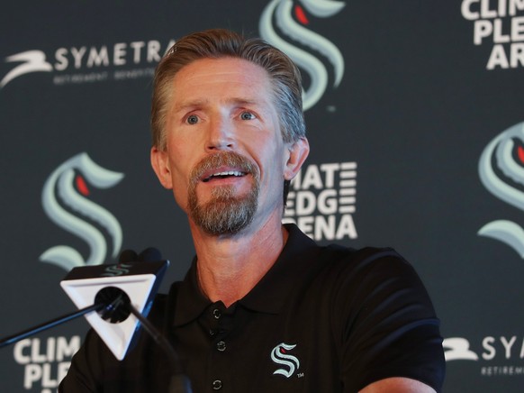 New Seattle Kraken Head Coach Dave Hakstol listens during a news conference, Thursday, June, 24, 2021 in Seattle. The Kraken hired Hakstol as head coach of the expansion franchise that will begin its  ...