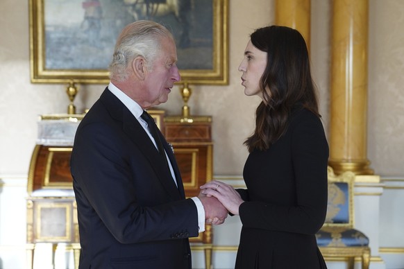King Charles III speaks with Prime Minister of New Zealand, Jacinda Ardern, as he receives realm prime ministers in the 1844 Room at Buckingham Palace in London, Saturday, Sept. 17, 2022. (Stefan Rous ...