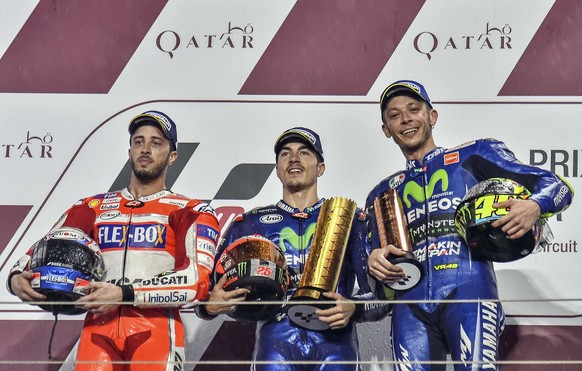 From left to right: Italian MotoGP rider Andrea Dovizioso of the Ducati Team MotoGP, Spanish rider Maverick Vinales of the Movistar Yamaha MotoGP and Italian rider Valentino Rossi of the Movistar Yama ...