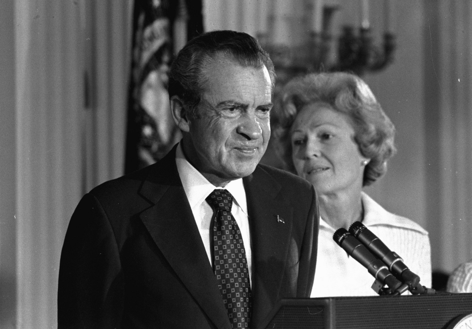 FILE - In this Aug. 9, 1974 black-and-white file photo, President Richard M. Nixon and his wife Pat Nixon are shown standing together in the East Room of the White House in Washington. Thirty-six year ...