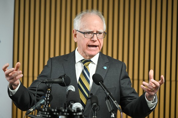epa12632144 Democratic Governor of Minnesota Tim Walz responds to a question from the news media during a press conference in Minneapolis, Minnesota, USA, 06 January 2026. Governor Walz, under fire fo ...