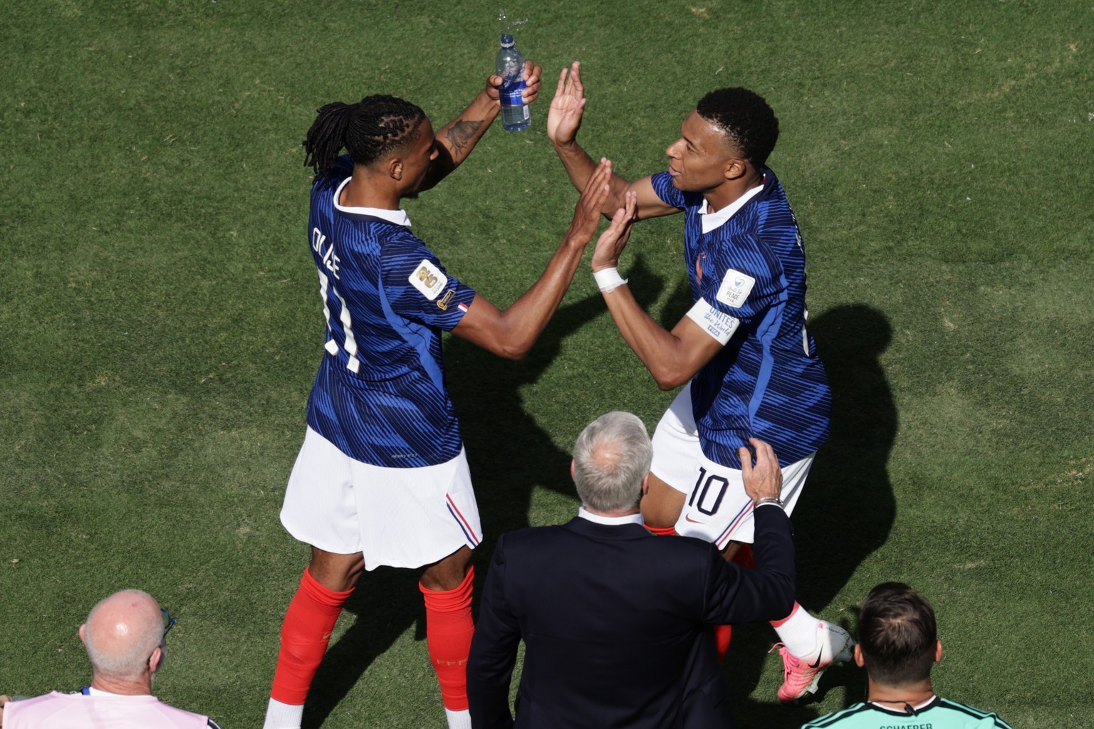 France's Michael Olise, left, and Kylian Mbappe celebrate after scoring the opening goal during the World Cup Group I soccer match between France and Senegal in East Rutherford, N.J., near New Yo ...