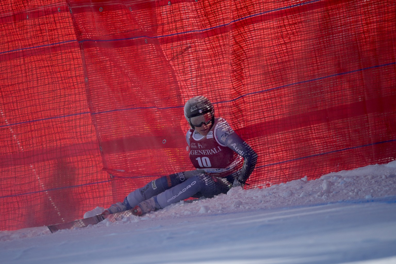 Italy&#039;s Federica Brignone sits up after crashing during an alpine ski, women&#039;s World Cup downhill race, in Cortina d&#039;Ampezzo, Italy, Friday, Jan. 26, 2024. (AP Photo/Giovanni Zenoni)