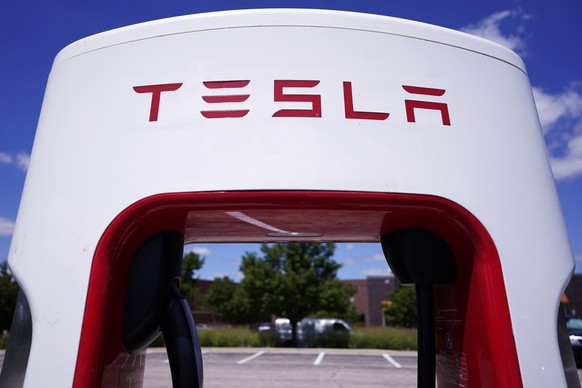 FILE - A Tesla Supercharger is seen at Willow Festival shopping plaza parking lot, Aug. 10, 2022, in Northbrook, Ill. On Monday, May 15, 2023, Delaware?s Supreme Court overturned a judge?s ruling upho ...