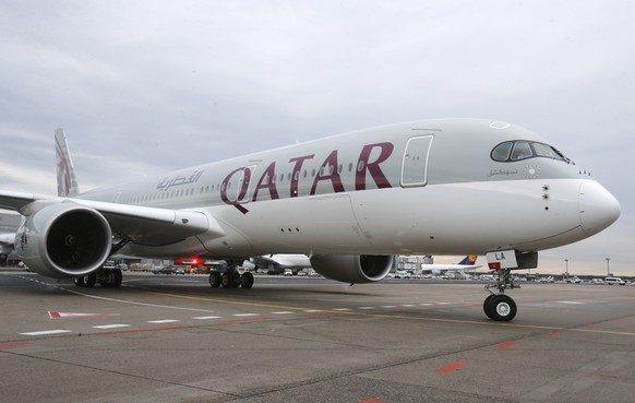 FILE - In this Jan. 15, 2015, file photo, a new Qatar Airways Airbus A350 approaches the gate at the airport in Frankfurt, Germany. On Monday, Dec. 20, 2021, Qatar Airways said the company is taking A ...