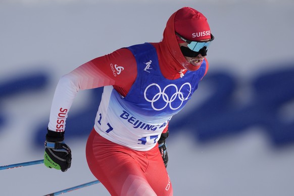 Switzerland&#039;s Dario Cologna competes during the men&#039;s weather-shortened 50km mass start free cross-country skiing competition at the 2022 Winter Olympics, Saturday, Feb. 19, 2022, in Zhangji ...