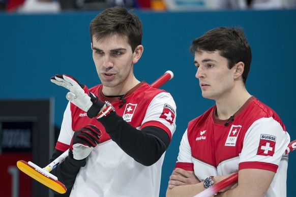 epa06542296 Peter de Cruz (L) and Benoit Schwarz of Switzerland look on during the men&#039;s Curling round robin game between Switzerland and Sweden in the Gangneung Curling Center during the PyeongC ...