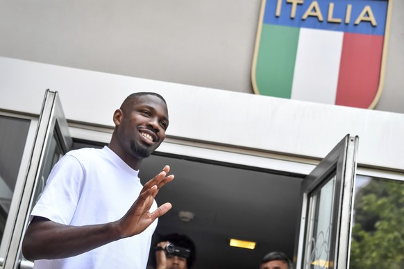 French soccer player Marcus Thuram waves to fans at the CONI (Italian National Olympic Committee) where he attended medical examinations, in Milan, Italy, Tuesday, June 27, 2023. Thuram signed a five- ...