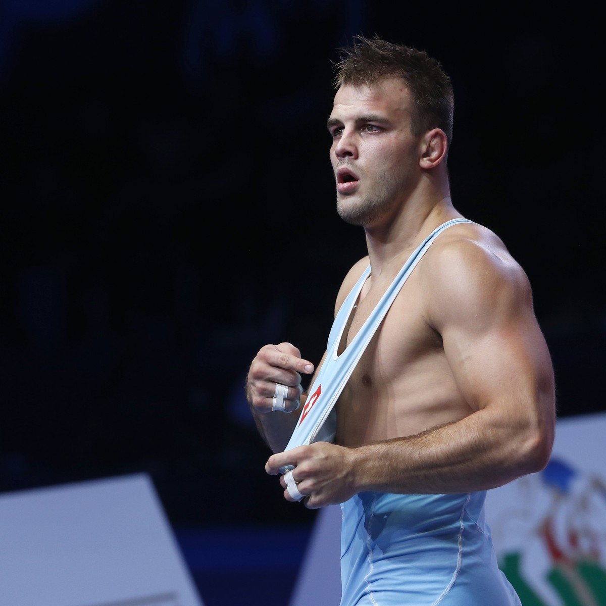 Stefan Reichmuth, of Switzerland, celebrates his victory over Carlos Arturo Izquierdo Mendez, of Columbia, in their bronze match of the men's 86 kg category during the Wrestling World Championshi ...