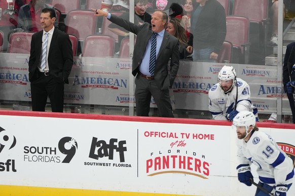 Tampa Bay Lightning head coach Jon Cooper watches during the third period of an NHL hockey preseason game against the Florida Panthers, Saturday, Oct. 4, 2025, in Sunrise, Fla. (AP Photo/Lynne Sladky) ...