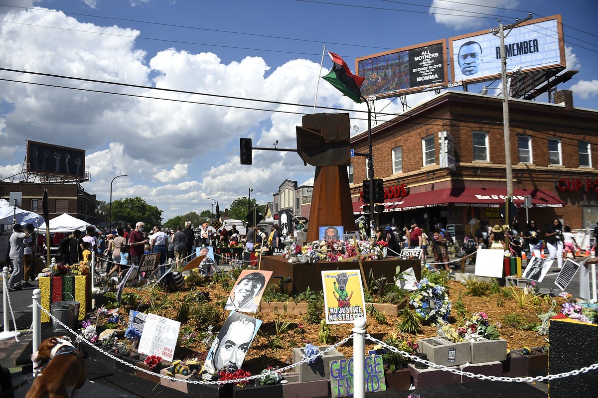 epa09227817 People gather at 38th Street and Chicago Ave., the area called George Floyd's Square, and the sight where Floyd was killed one year ago today and where a day of events are planned to  ...