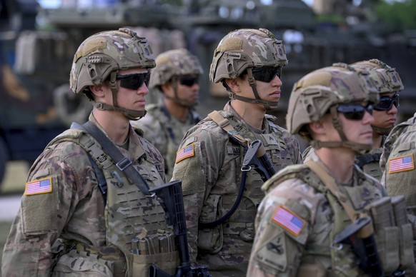 U.S. army soldiers line up at the Vay Adam Military Training Base near Hajduhadhaz, northeastern Hungary, Wednesday, June 15, 2022. The American unit carries out a joint patrol with Hungarian troops i ...