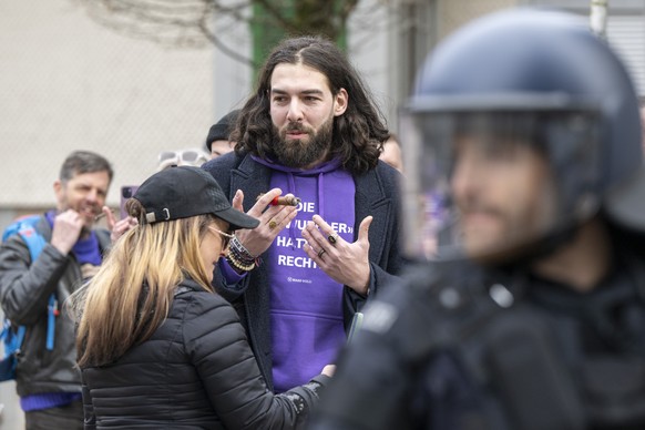 Activist Nicolas A. Rimoldi, centre, opponent of the &quot;Demo against the right&quot; in solidarity with Germany, on Saturday, 22 February 2025, in Einsiedeln, Switzerland. An authorised &quot;Demo  ...