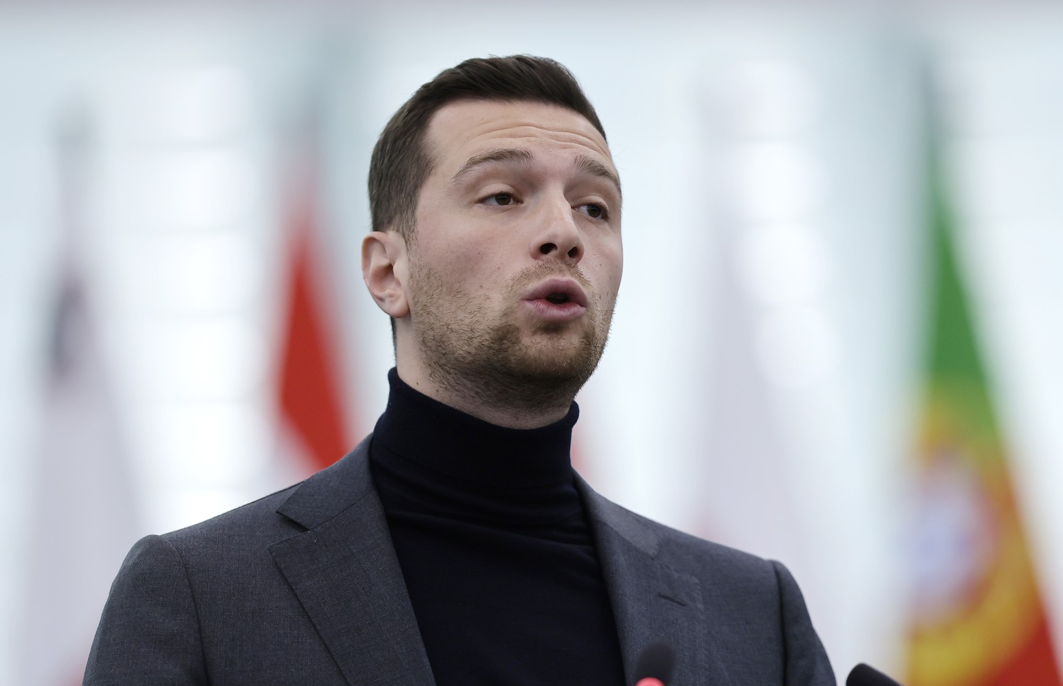 epa11841876 Jordan Bardella, President of the French National Rally (RN) and chairman of the Patriots for Europe group in the European Parliament, speaks during a debate on the &#039;geopolitical and  ...