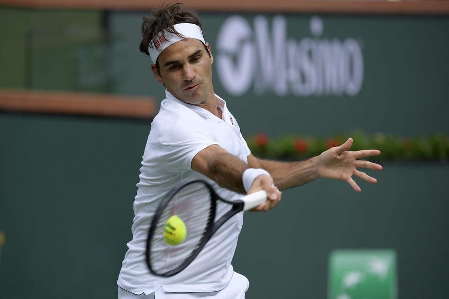 Roger Federer, of Switzerland, returns a shot to Peter Gojowczyk, of Germany, at the BNP Paribas Open tennis tournament Sunday, March 10, 2019, in Indian Wells, Calif. (AP Photo/Mark J. Terrill)