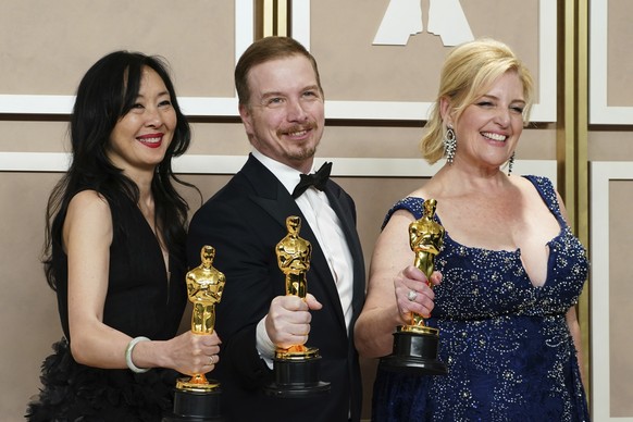 Judy Chin, from left, Adrien Morot and Annemarie Bradley pose with their awards for Best Makeup and Hair Styling for "The whale" in the press room at the Oscars on Sunday, March 12, 2023, at…
