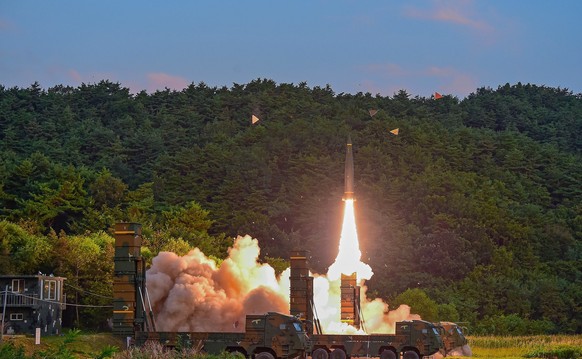 epa06182556 A handout photo made available by the South Korea Defense Ministry shows a Hyunmoo-2 missile being launched at an undisclosed location on the east coast of South Korea, 04 September 2017,  ...