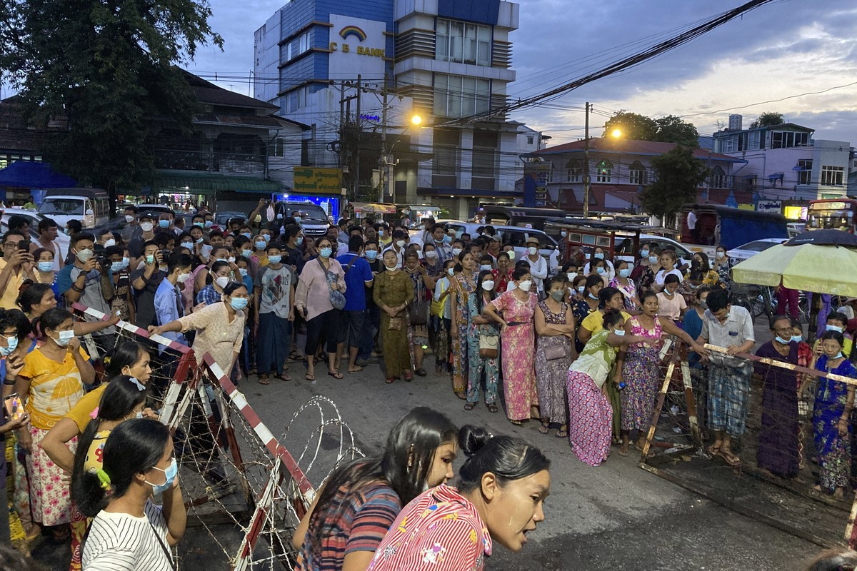 Family members wait for prisoners outside Insein Prison in Yangon, Myanmar, Monday, Oct. 18, 2021. Myanmar's government on Monday announced an amnesty for more than 5,600 people arrested for taki ...