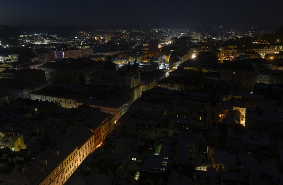 epa12721114 Image taken from an elevated position at the town hall shows the dark city centre during a power cut in Lviv, Western Ukraine, 09 February 2026, amid the ongoing Russian invasion. All of U ...