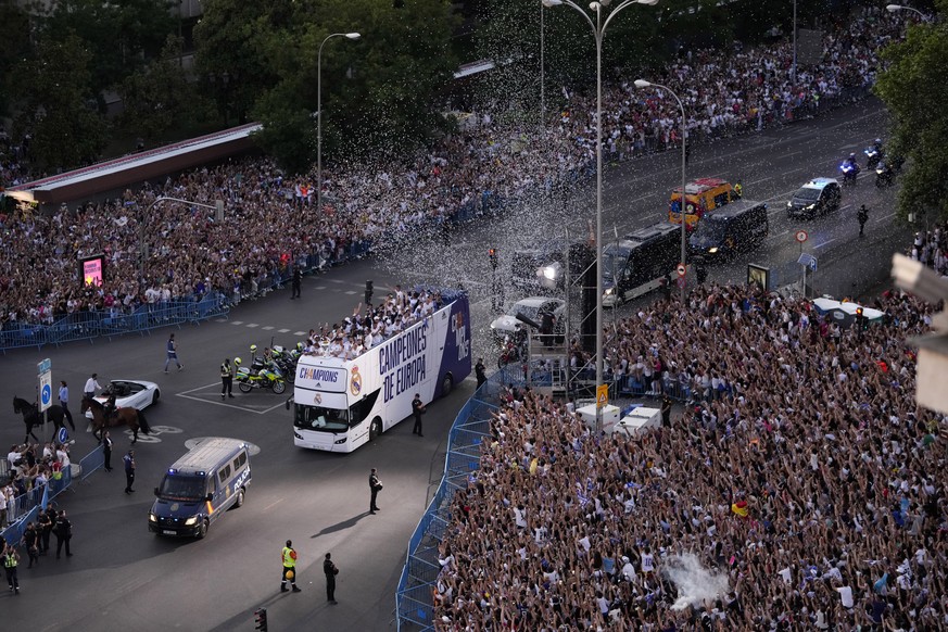 Real Madrid players on an open-top bus during the trophy parade in front of the City Hall in Madrid, Spain, Sunday, May 29, 2022. Real Madrid beat Liverpool 1-0 in the Champions League final in Paris. ...