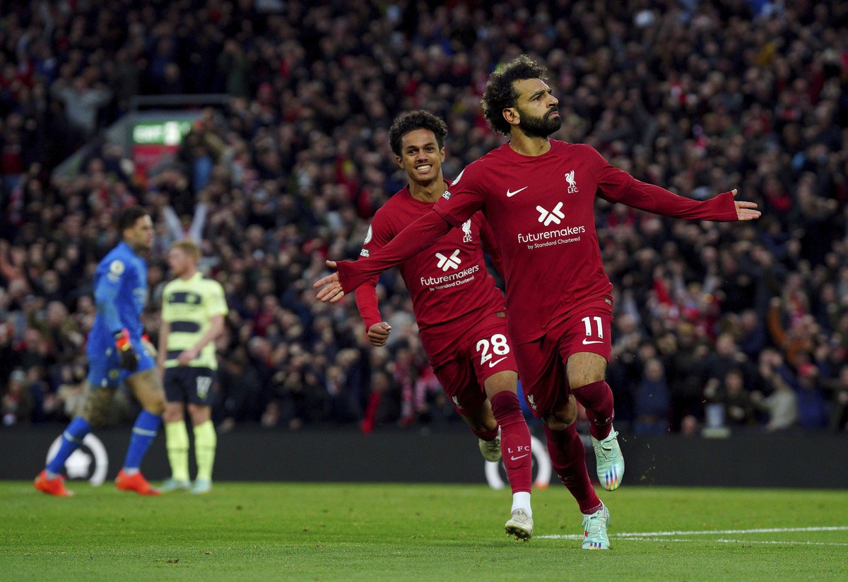 Liverpool's Mohamed Salah celebrates after scoring his side's opening goal during the English Premier League soccer match between Liverpool and Manchester City at Anfield stadium in Liverpoo ...