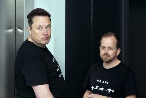 Tesla CEO Elon Musk, left, and Andr