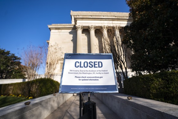 epa07249305 A sign alerts visitors to the closure of the National Archives on the fifth day of a partial government shutdown in Washington, DC, USA, 26 December 2018. Last week, President Trump reject ...