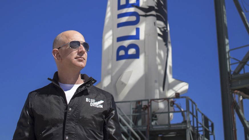 epa09252931 An undated handout photo made available by Blue Origin shows Blue Origin founder Jeff Bezos inspects New Shepard?s West Texas launch facility before the rocket?s maiden voyage, in West Tex ...