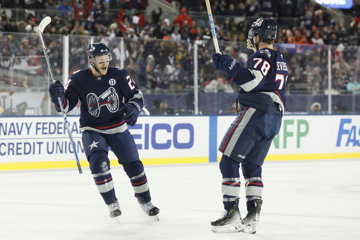 Columbus Blue Jackets' Mathieu Olivier, left, celebrates his goal against the Detroit Red Wings with teammate Damon Severson during the second period of the Stadium Series NHL hockey game at Ohio ...