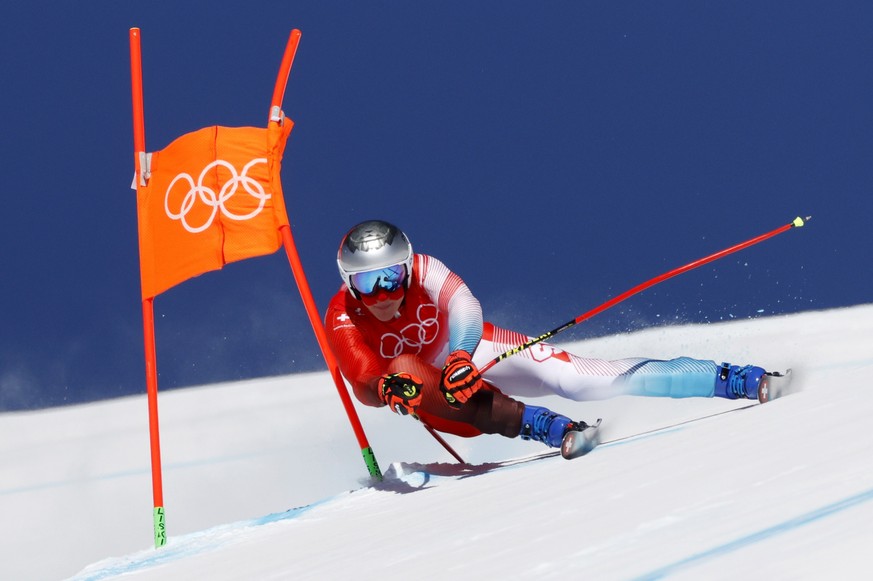 epa09726521 Marco Odermatt of Switzerland in action during the 2nd training run for the Men&#039;s Downhill race of the Alpine Skiing events of the Beijing 2022 Olympic Games at the Yanqing National A ...