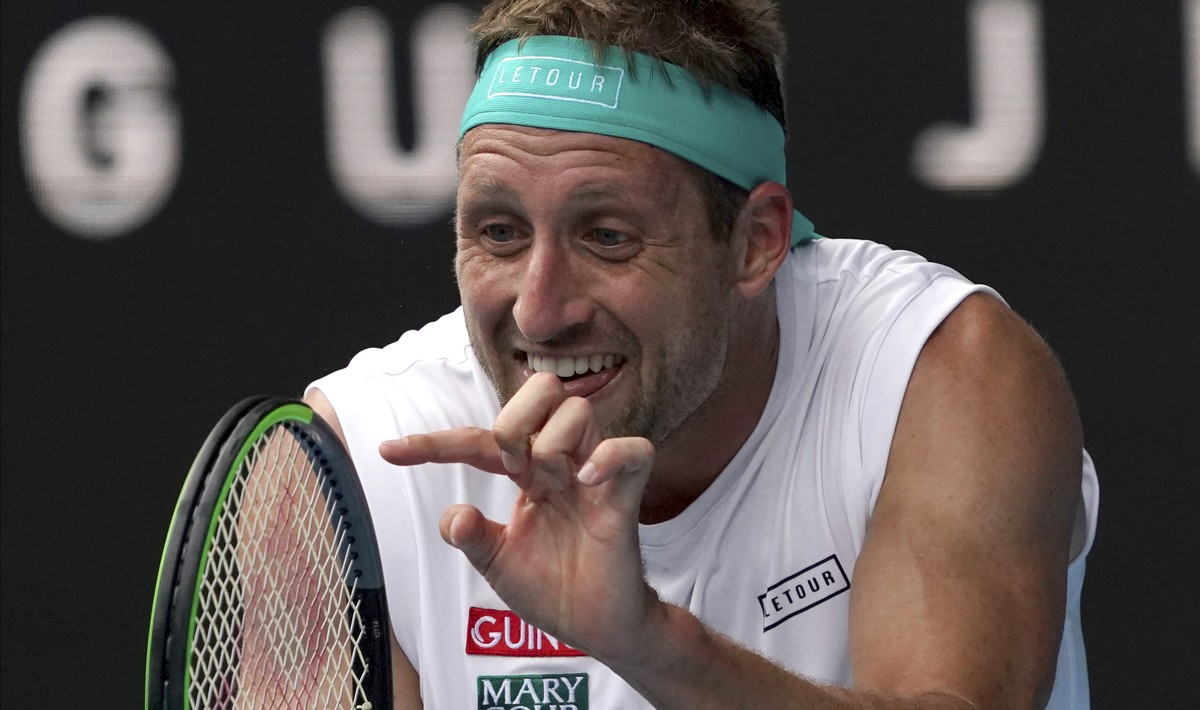 Tennys Sandgren of the U.S. reacts after losing a point to Switzerland's Roger Federer during their quarterfinal match at the Australian Open tennis championship in Melbourne, Australia, Tuesday, ...