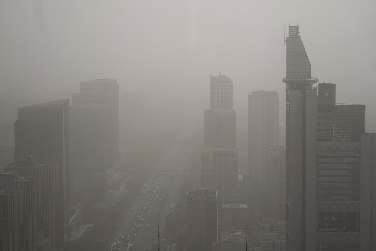 Buildings are shrouded in dust and sand in Beijing, Tuesday, April 11, 2023. The latest in a series of dust and sand storms sent air quality indices soaring in China's capital overnight on Monday ...