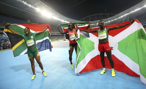 2016 Rio Olympics - Athletics - Final - Women&#039;s 800m Final - Olympic Stadium - Rio de Janeiro, Brazil - 20/08/2016. Caster Semenya (RSA) of South Africa, Francine Niyonsaba (BDI) of Burundi and M ...