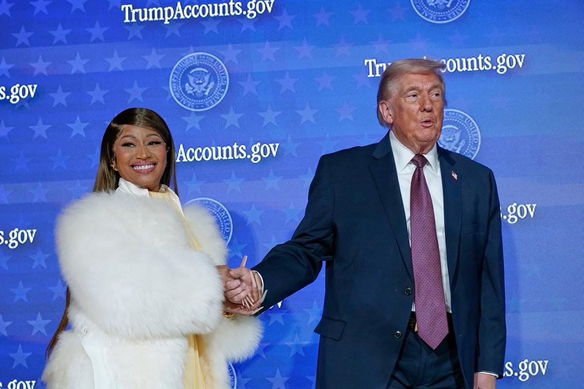 Nicki Minaj and President Donald Trump stand on stage during the launch of a program known as Trump Accounts at the Andrew W. Mellon Auditorium, Wednesday, Jan. 28, 2026, in Washington. (AP Photo/Jose ...