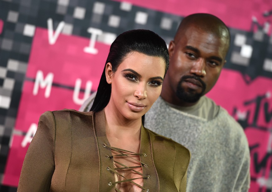 FILE - In this Aug. 30, 2015, file photo, Kim Kardashian, left, and Kanye West arrive at the MTV Video Music Awards at the Microsoft Theater in Los Angeles. Kardashian praised her husband&#039;s May 1 ...