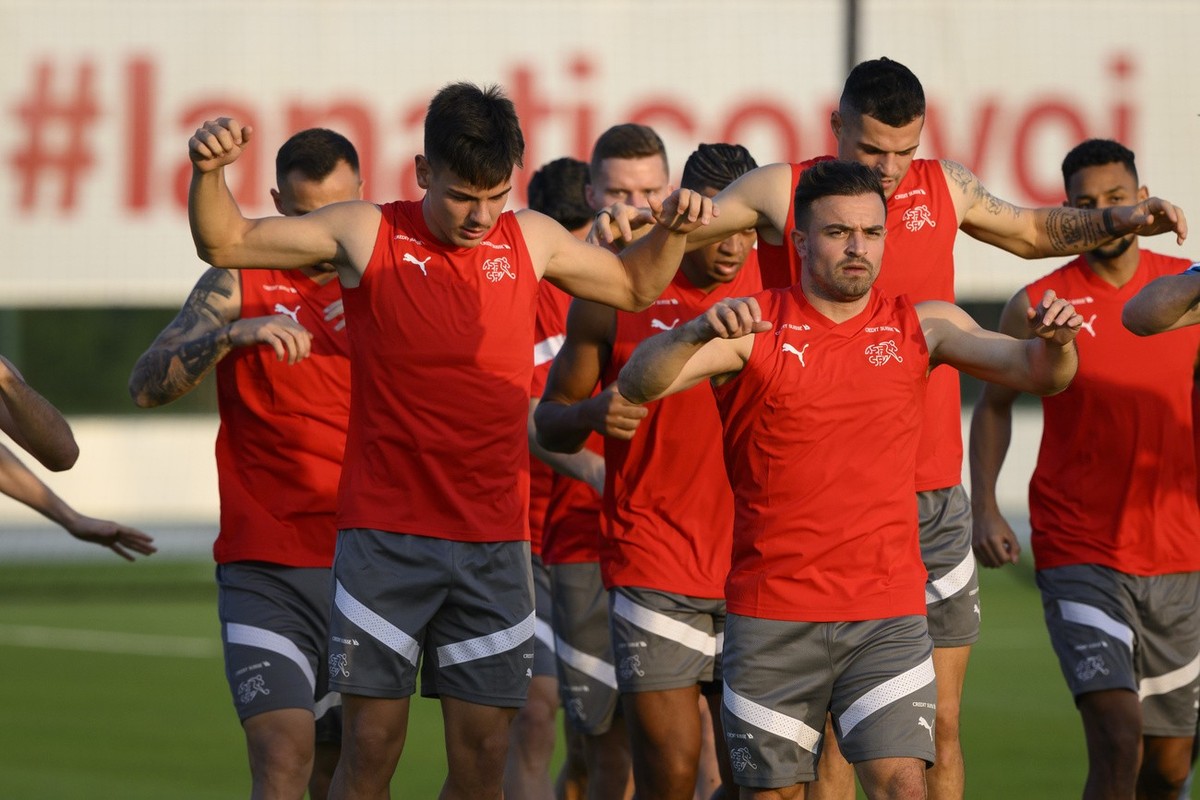 From left, Switzerland's midfielder Ardon Jashari, Switzerland's midfielder Xherdan Shaqiri and Switzerland's midfielder Granit Xhaka warm up during a open training session of Swiss nat ...