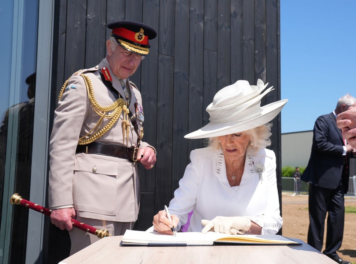 VER-SUR-MER, FRANCE - JUNE 6: King Charles III and Queen Camilla sign the guestbook at the official opening of the Winston Churchill Education and Learning Centre, on the site of the British Normandy  ...