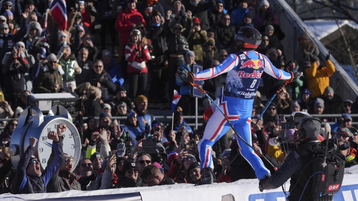 France's Cyprien Sarrazin celebrates at the finish area of an alpine ski, men's World Cup downhill race, in Kitzbuehel, Austria, Saturday, Jan. 20, 2024. (AP Photo/Giovanni Auletta)