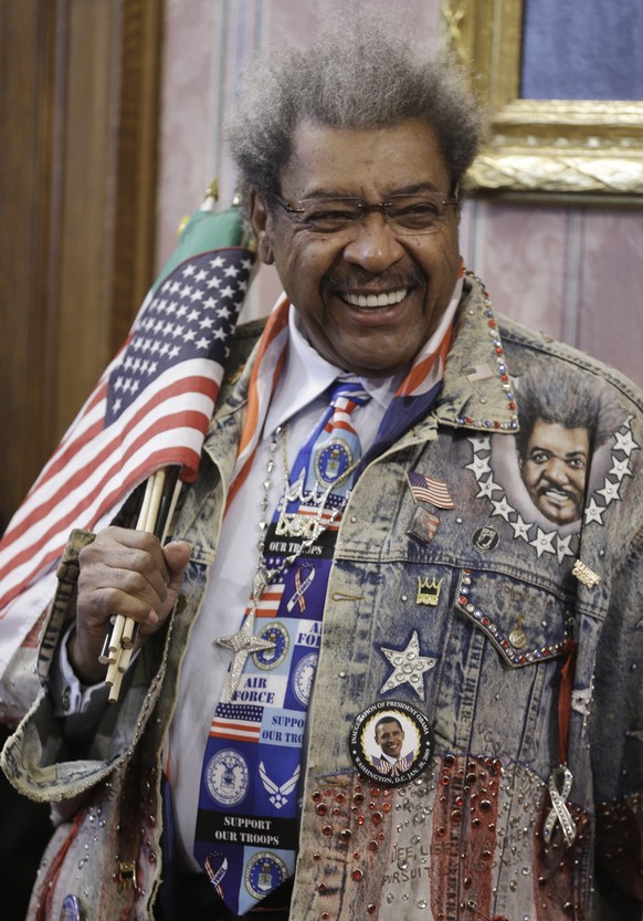 Promoter Don King smiles before being introduced during a news conference Tuesday, Feb. 11, 2014, in Cleveland. King was in Cleveland to promote a boxing event Feb. 21, 2014. The boxing event will fea ...