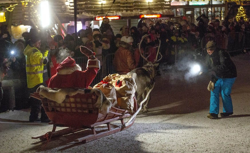 A person dressed up as Santa sits in a slay, as he leaves Santa&#039;s Village at the Arctic Circle, Rovaniemi, Finnish Lapland, Sunday, Dec. 23, 2018. (Laura Haapam&#039;ki/Lehtikuva via AP)