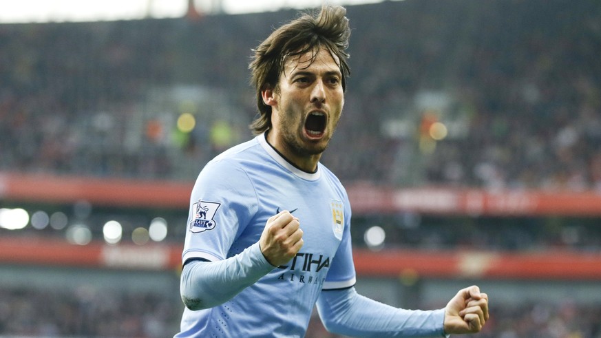 Manchester City&#039;s David Silva celebrates scoring a goal during the English Premier League soccer match between Arsenal and Manchester City at the Emirates stadium in London, Saturday, March 29, 2 ...