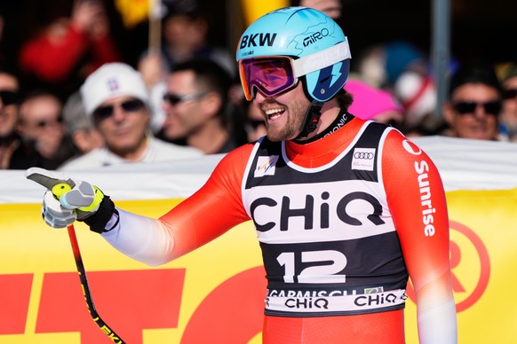 Switzerland's Alexis Monney reacts at the finish area, during a men's World Cup downhill race, in Garmisch Partenkirchen , Germany, Saturday, Feb. 28, 2026. (AP Photo/Giovanni Auletta)
Alexi ...