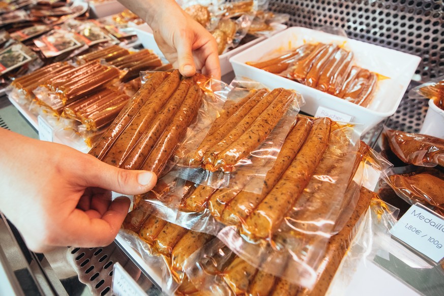 epa07851020 Vegan products are on display at the vegan sausage butcher shop L&#039;herbivore in Berlin, Germany, 17 September 2019 (issued on 18 September 2019). The Sausage skin is made of a special  ...