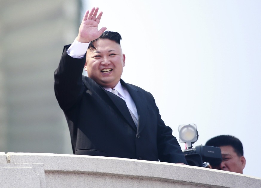 epa05908579 North Korean leader Kim Jong-un waves from a balcony during a parade for the &#039;Day of the Sun&#039; festival on Kim Il-Sung Square in Pyongyang, North Korea, 15 April 2017. North Korea ...