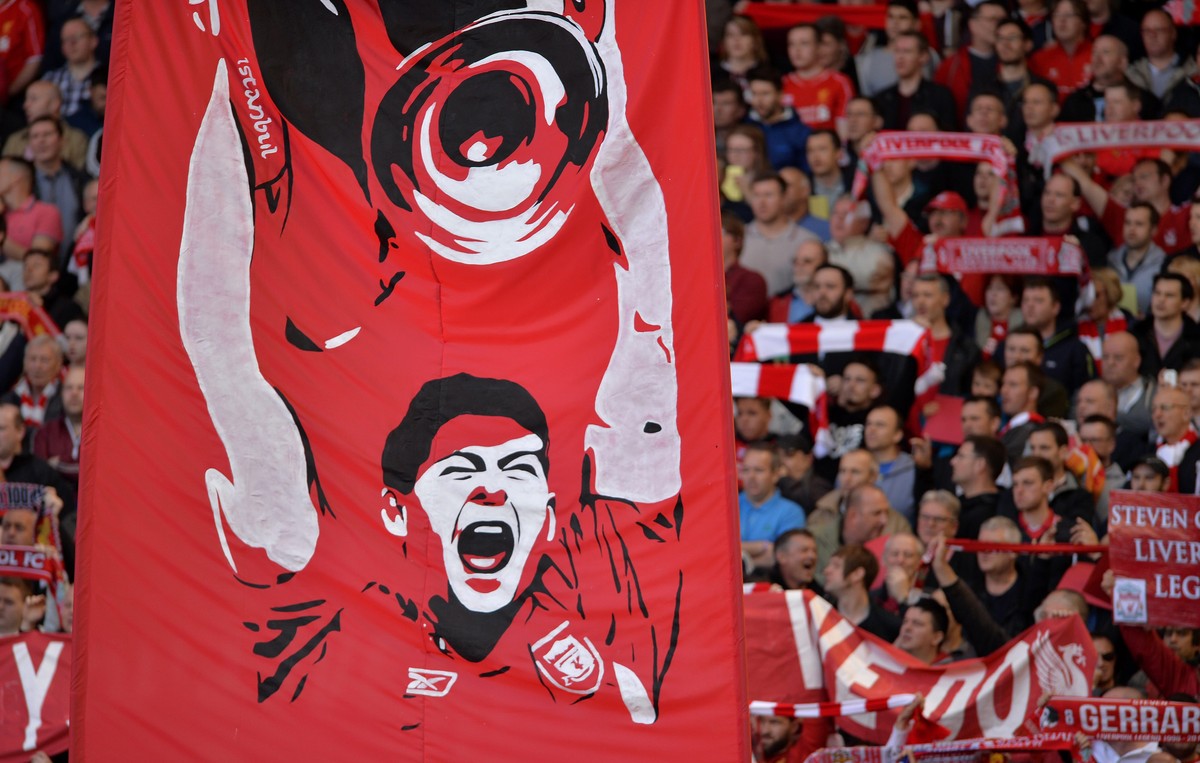 epa05645113 (FILE) A file of a flag with a drowning of Liverpool's Steven Gerrard is held up in the Kop stand at Anfield before the English Premier League soccer match between Liverpool and Cryst ...