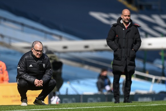 epa09126399 Leeds United manager Marcelo Bielsa (L) and Manchester City manager Pep Guardiola (R) during the English Premier League soccer match between Manchester City and Leeds United in Manchester, ...
